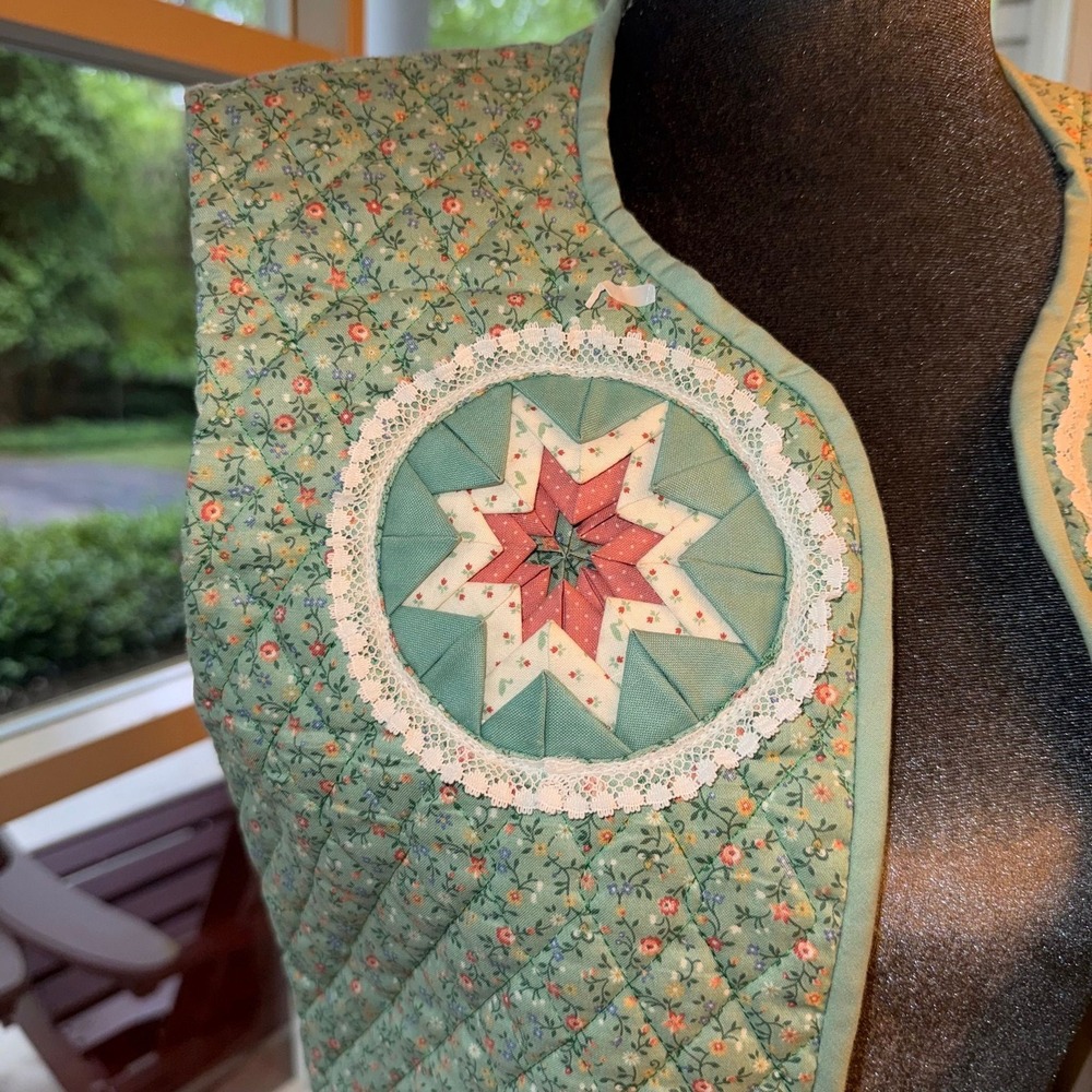 Handmade quilted vest with a floral‎ print and star